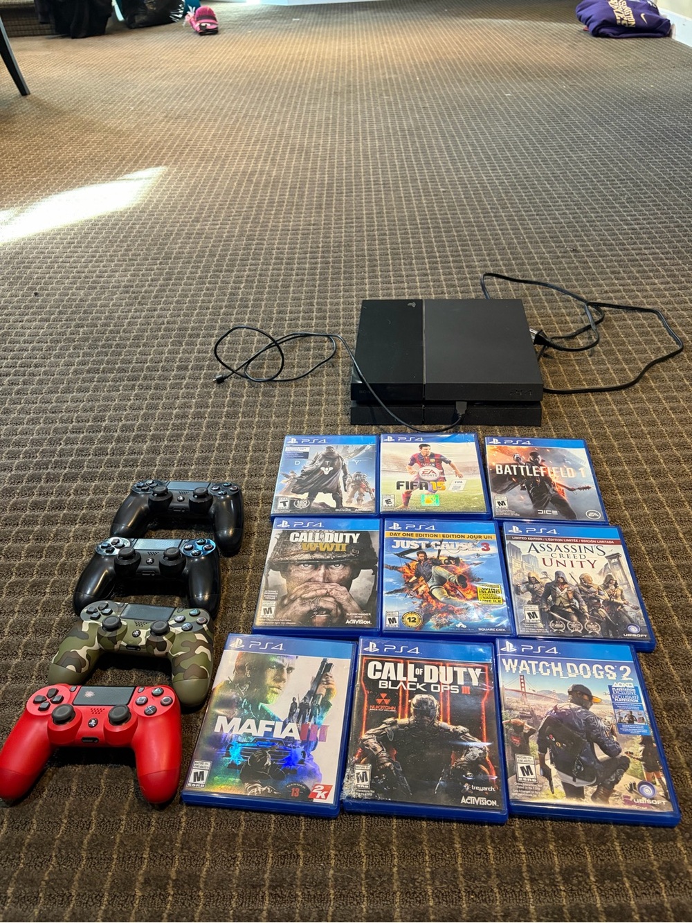 Sony Black PS4 Console with Four Controllers and 9 PS4 Games